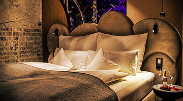 Gemütliches Bett im Doppelzimmer Spa Deluxe im Hotel Winzer